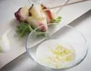Brocheta de pulpo y melón con aceite cítrico